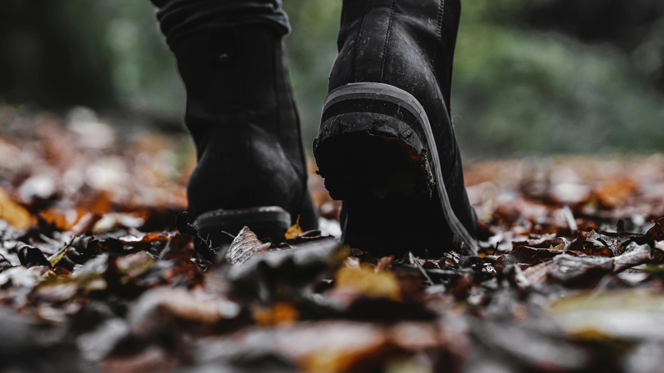 a close - up of a pair of boots near the ground