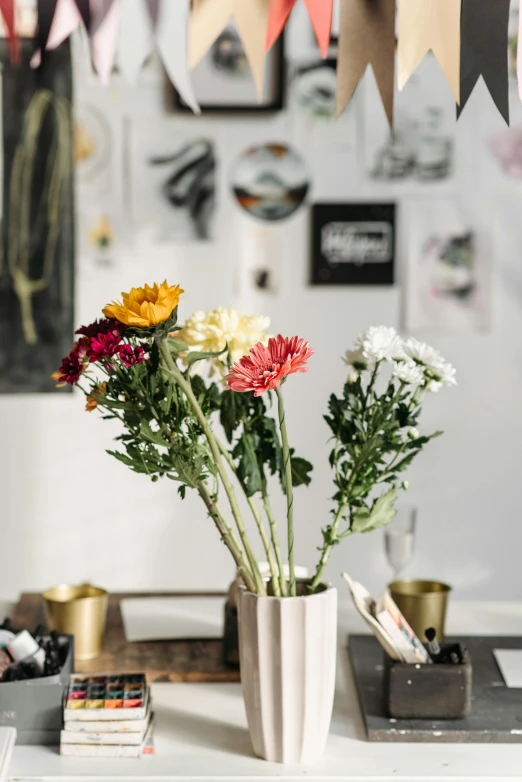 flowers are sitting in a vase on a table