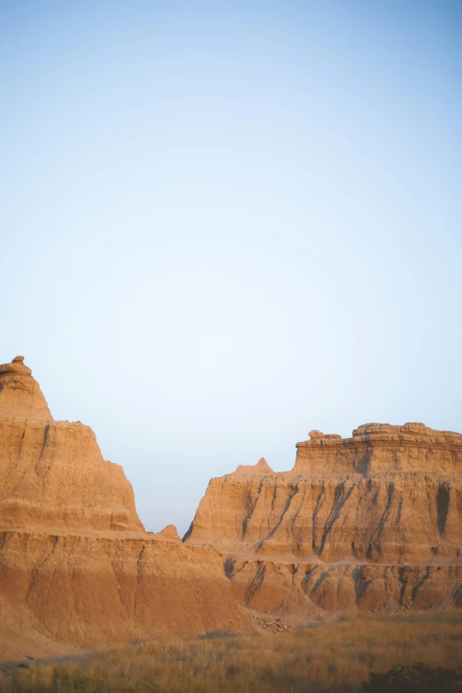 an elephant is resting on top of an eroded terrain