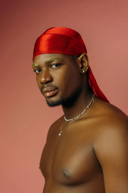 a male model with  on wearing a red bandanna