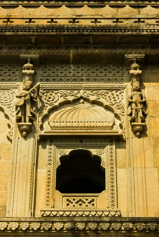 a door with carvings and statues on the outside