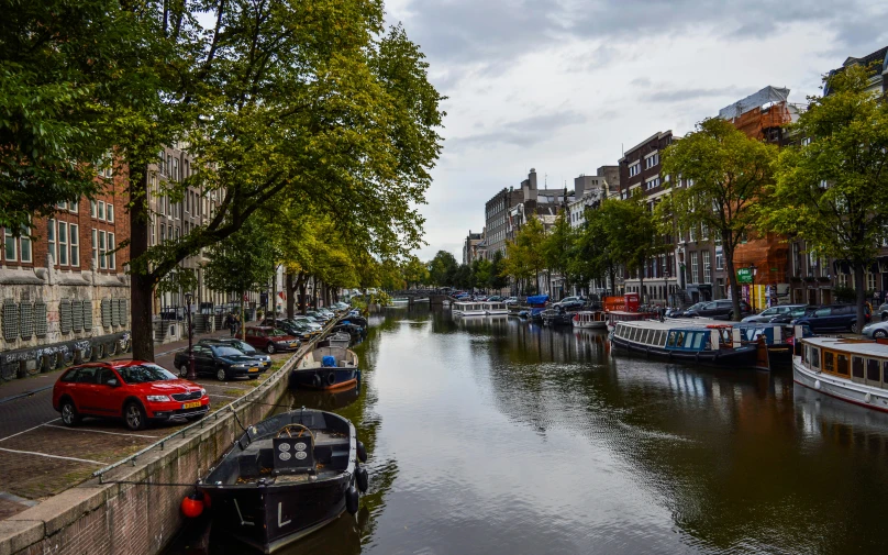 a river has many boats on it in the city