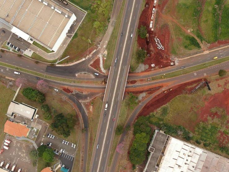 an overhead view of a street intersection with vehicles