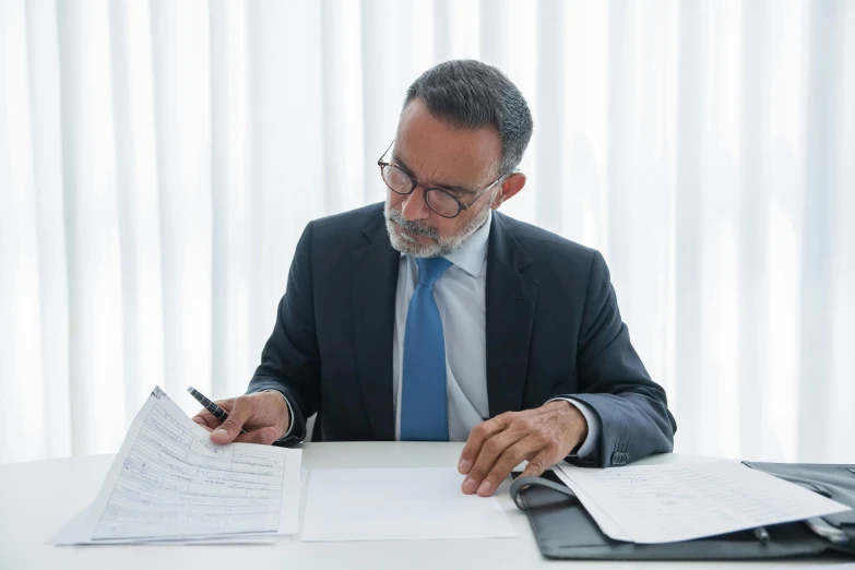 an image of man doing soing on his desk