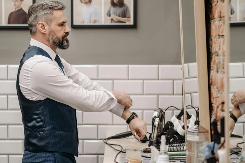 a man in a white shirt is in front of a counter