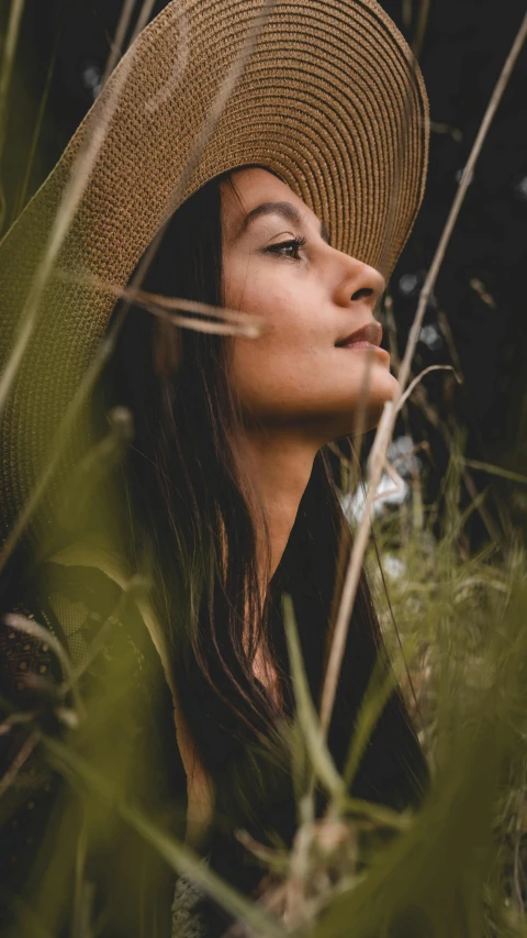 an image of a woman wearing a hat