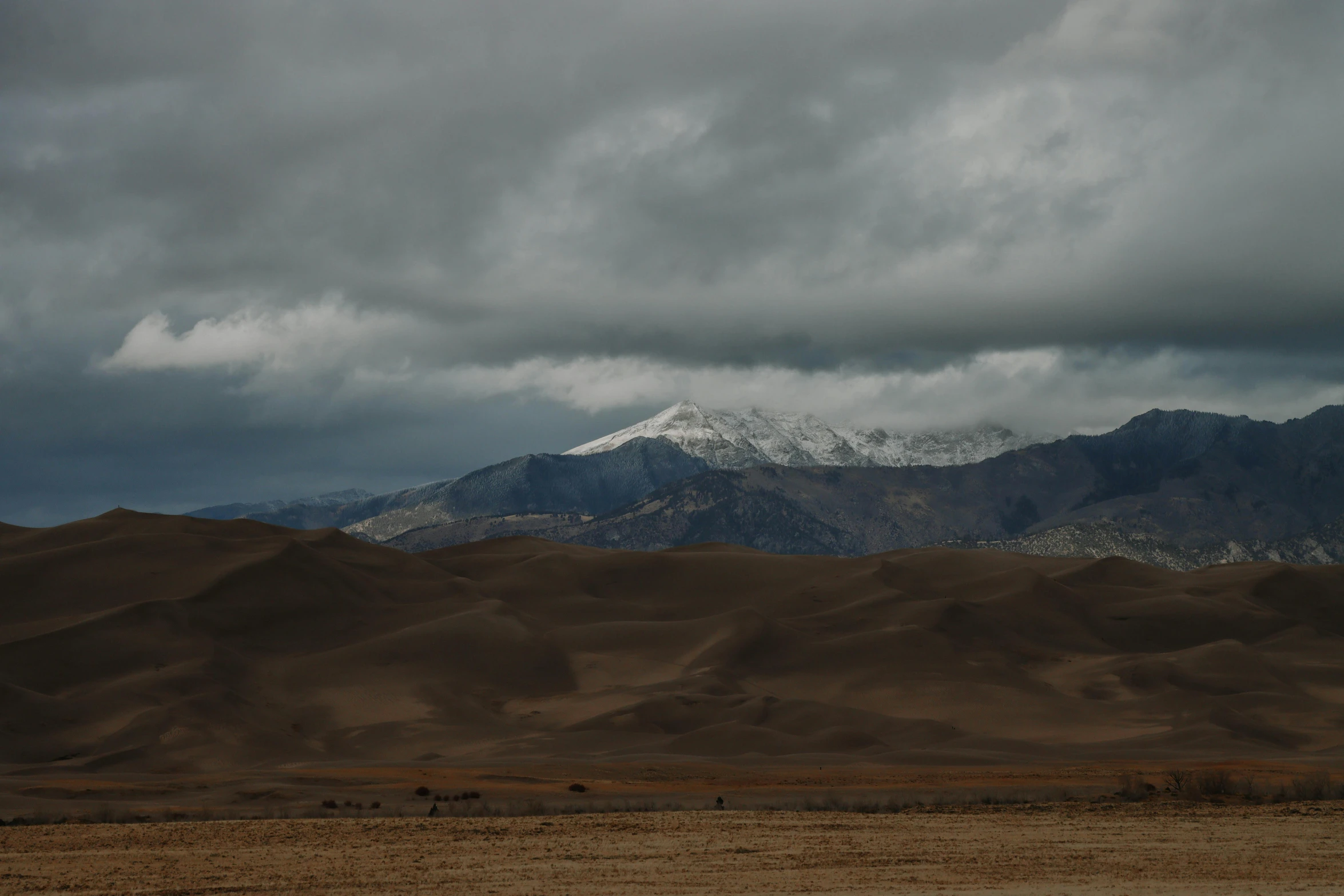 a very tall mountain sitting between many mountains