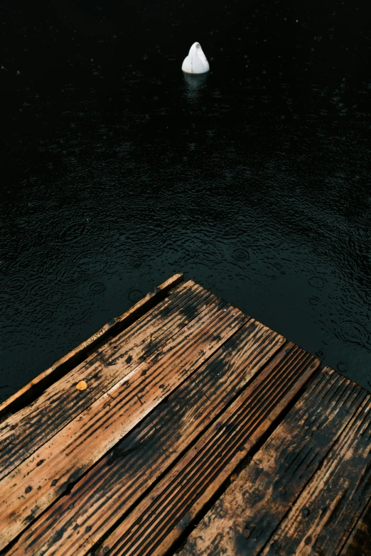 an image of a boat in the water with a boat dock next to it