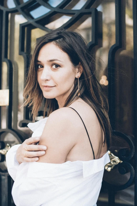 an image of woman in white shirt posing