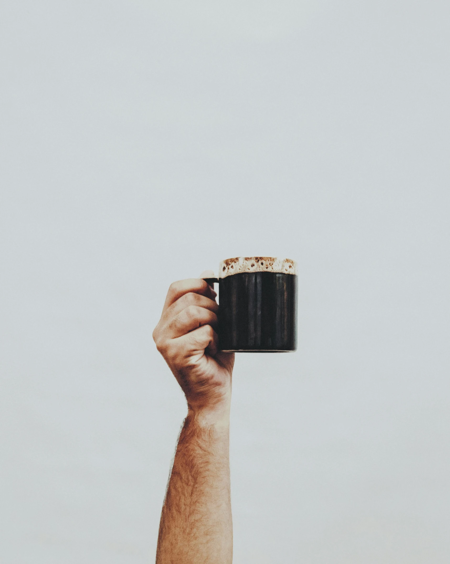 hand holding a cup with no background