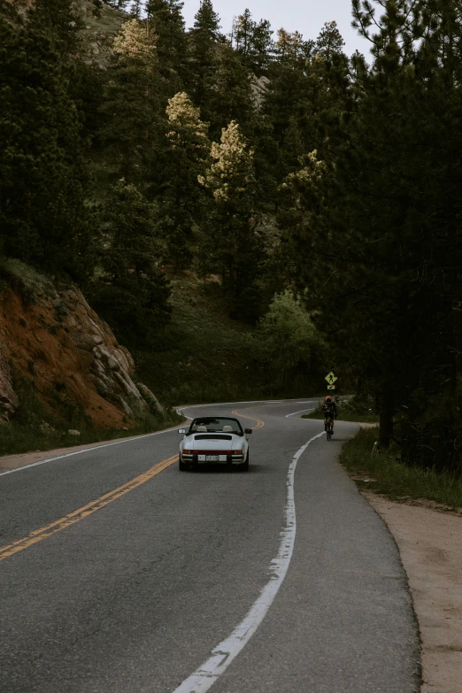 a car sitting on the road driving on it's side