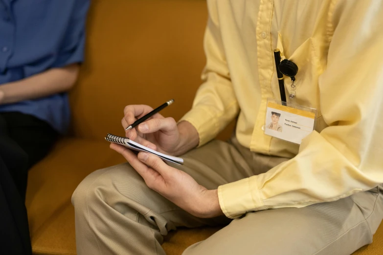 the person is holding some cell phone at the event