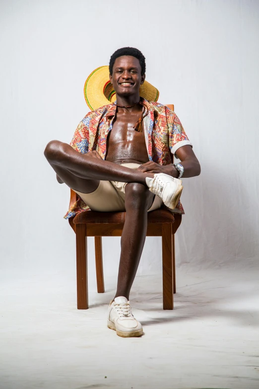 an older african man with his legs wrapped around a chair