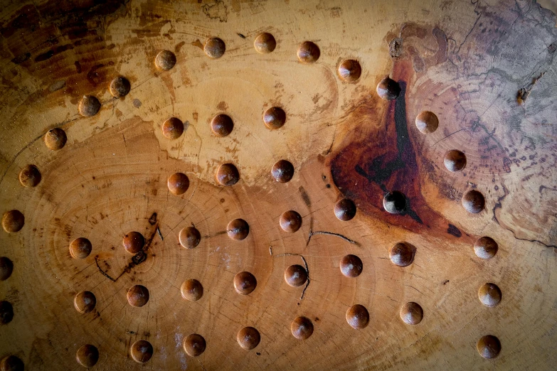 holes in the surface of a rusted metal surface