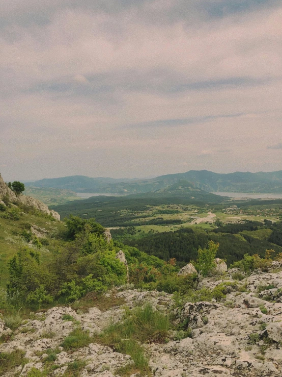 a small rock outcropping overlooking valley in the distance