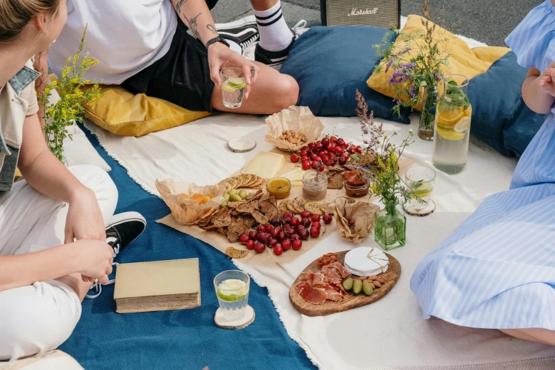 a group of people are enjoying a meal on the table