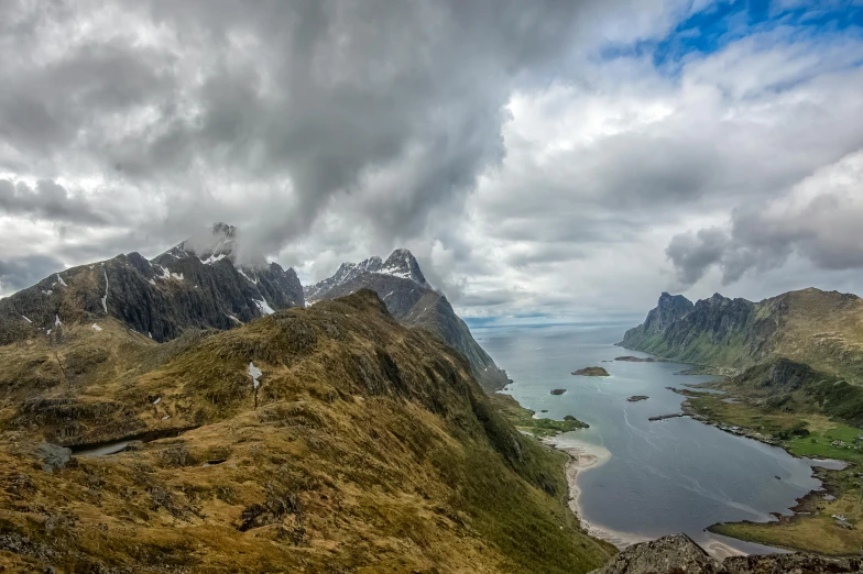 a po taken from a very high altitude looking down on some mountains and water