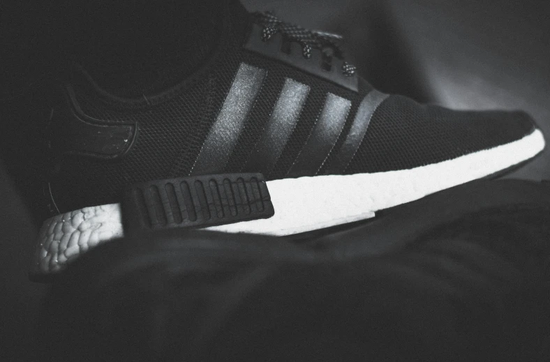 the adidas are black and white with white detailing