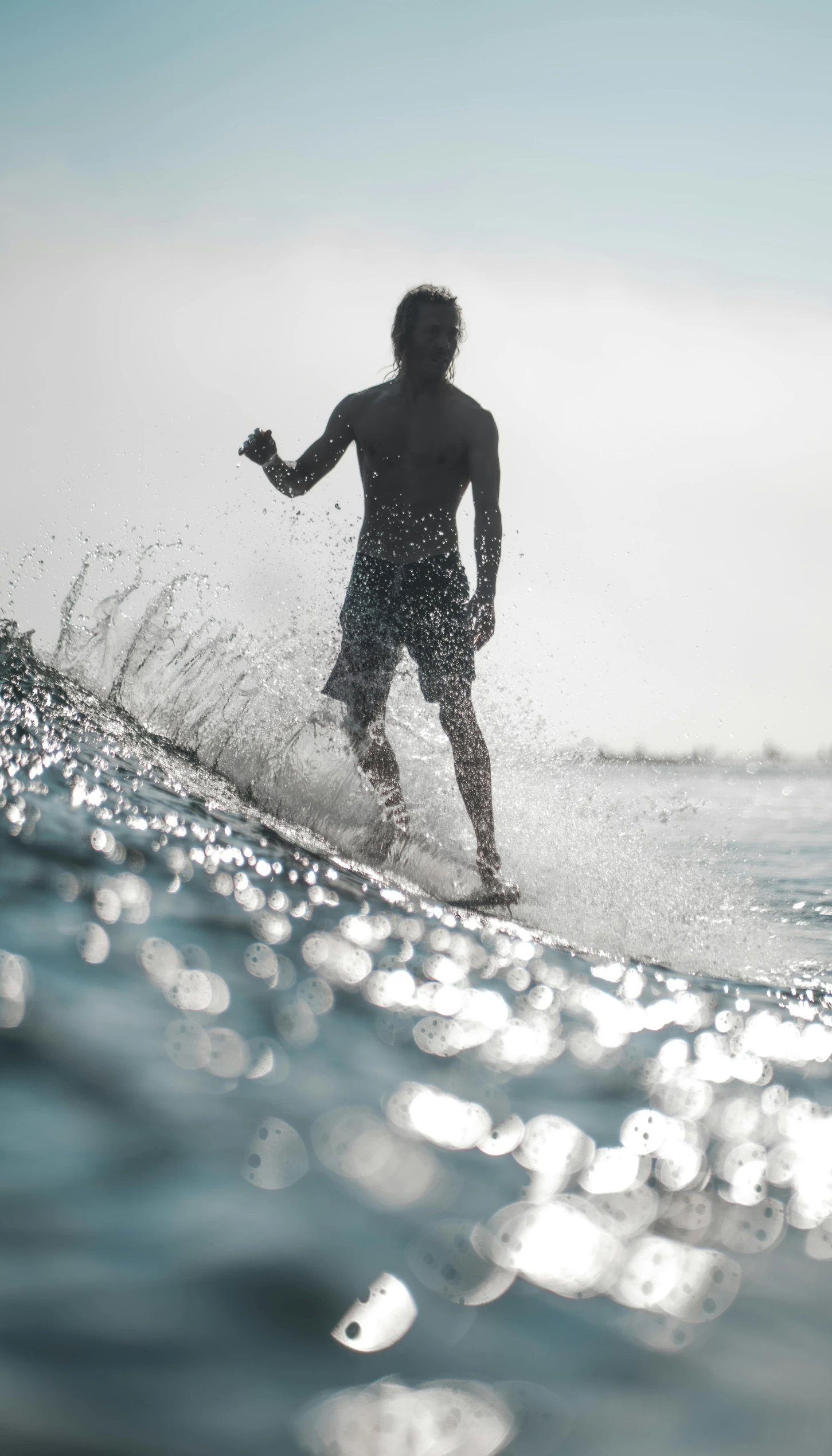 a man on the surf board on a wave