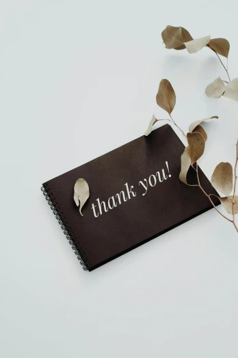 an envelope with a small thank you note, on the side
