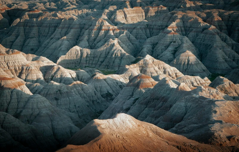 an aerial view of the desert with many different mountains