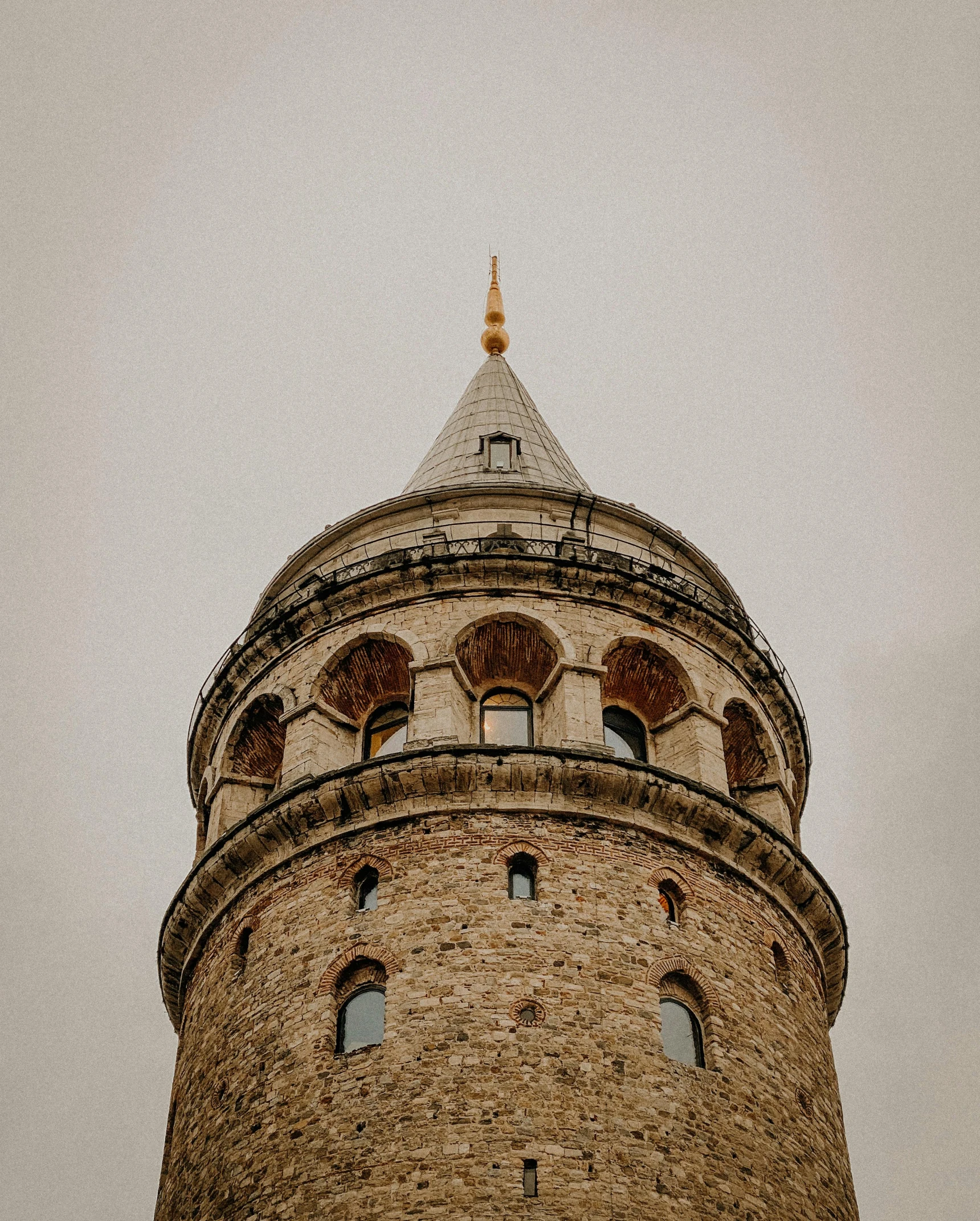 a tall building has two round windows near it