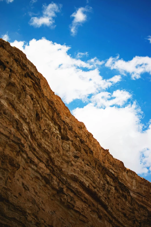 the mountain side is shown with two clocks above