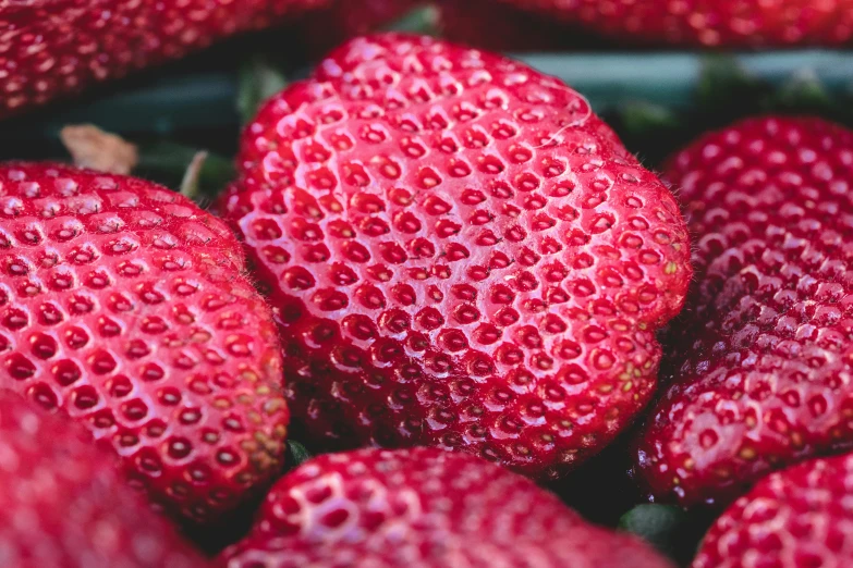 closeup of strawberries with water droplets on them