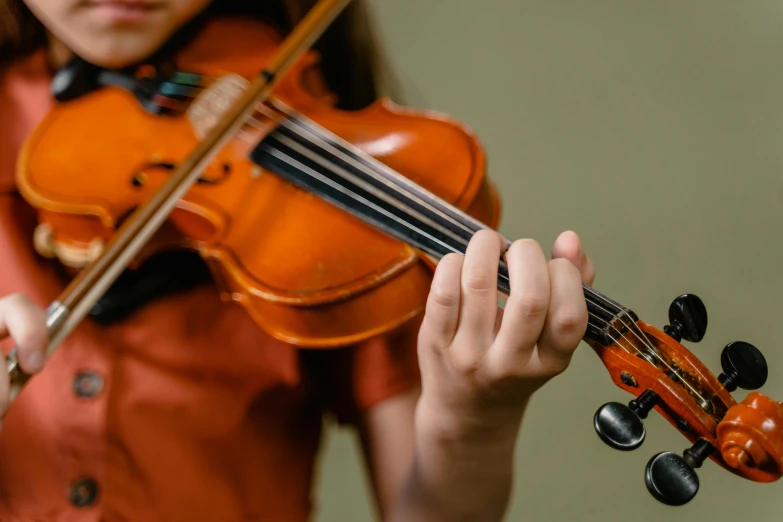 a woman with her violin holding it