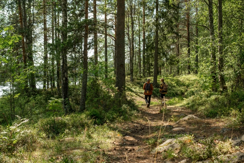 a person in the woods with a backpack and water