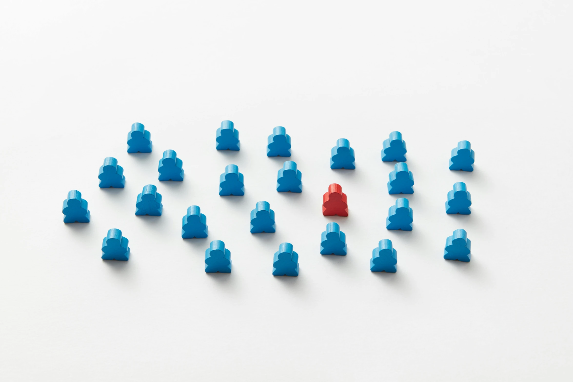 a group of small lego figures arranged in a triangle