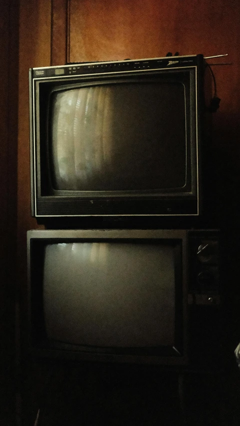 a tv and a book on a table