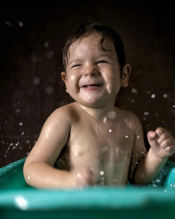 a young child sits in an old - fashioned bath tub smiling