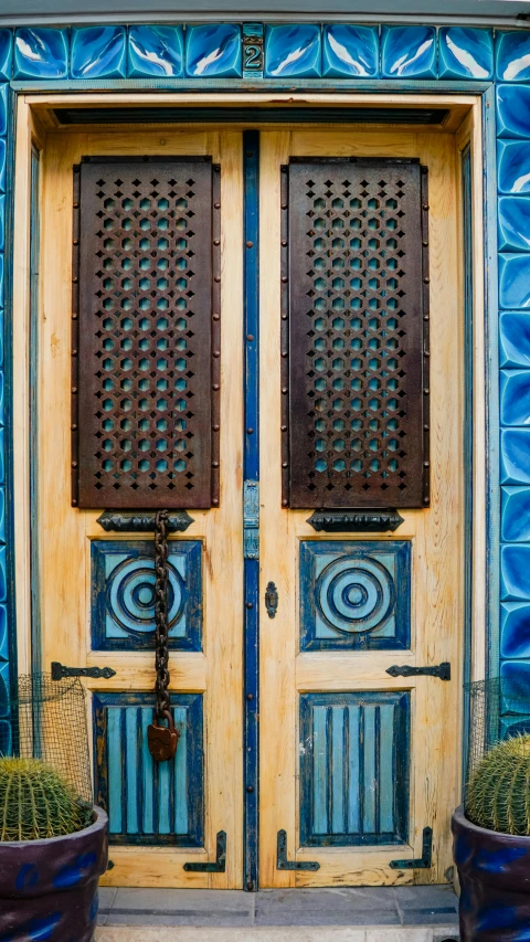 two pots are shown in front of a door