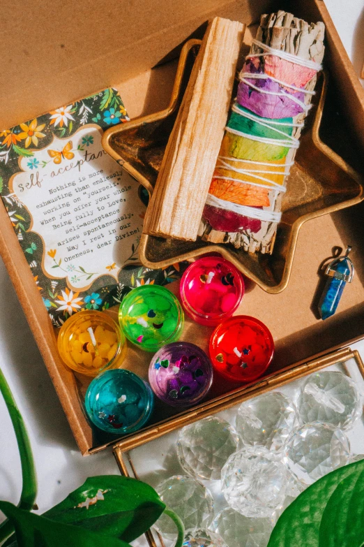 a box of soaps next to a sheet of wax