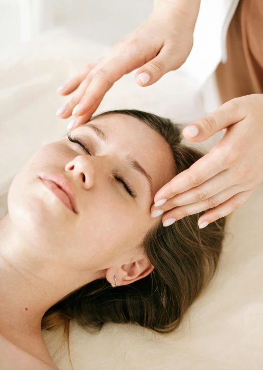 an image of a woman getting her head massage