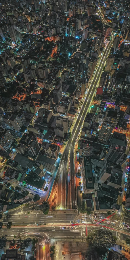 a city is seen from an aerial view at night