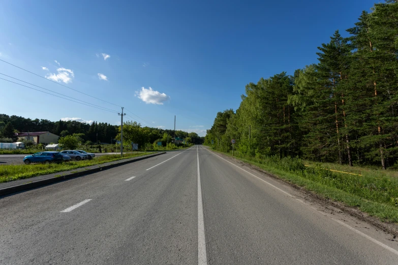 the road is empty and very wide in the country