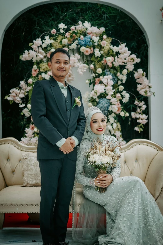 an asian wedding couple posing for the camera