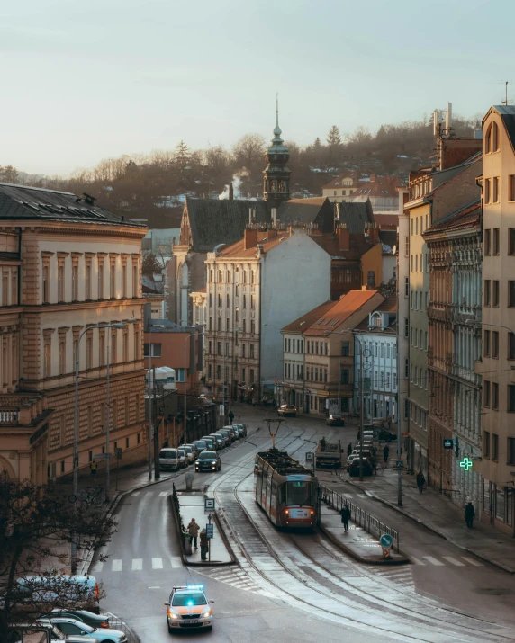 this city street has vehicles and a bus on it