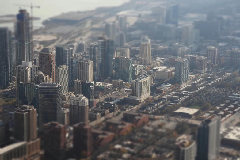 an aerial view of large city buildings and parking