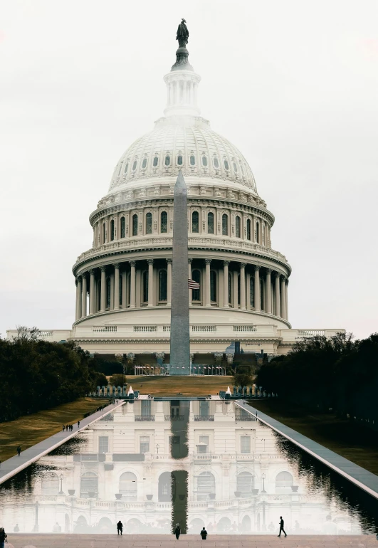 a washington d c capitol building is shown across from the reflecting pool