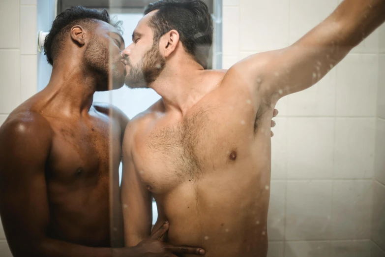 two  men standing in front of the mirror