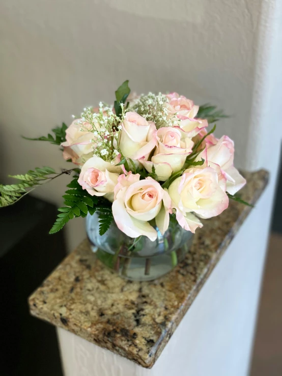 a bouquet of flowers sitting in a clear vase