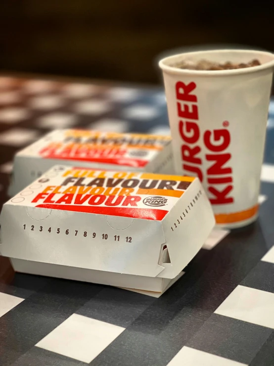 two king sized flavors of breakfast foods are sitting on a checkerboard table