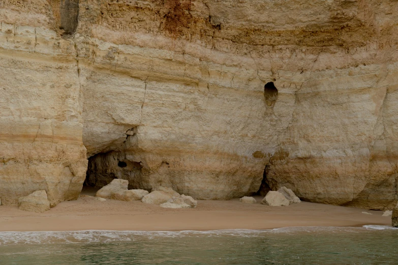 an image of a rocky beach and water