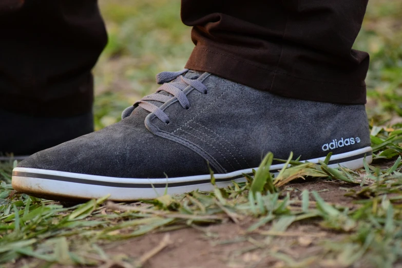 a close up image of someones feet in the grass