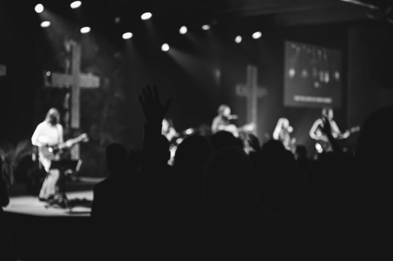 two people on stage at a concert in front of an audience