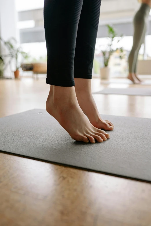 close - up of the feet of a woman in yoga attire