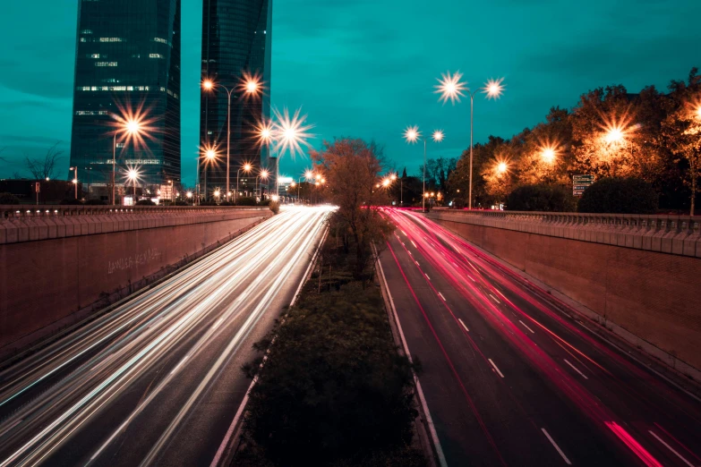 cars drive down a highway as the sun is set